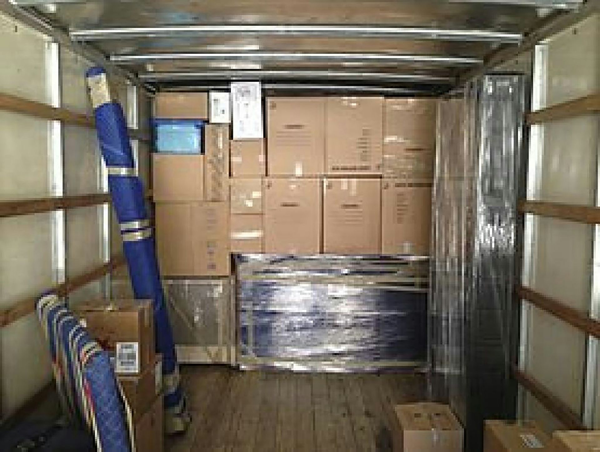 a truck with a bunch of boxes in the back of it